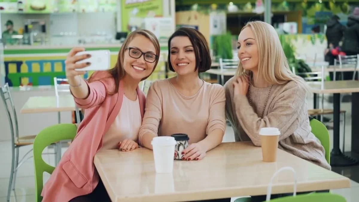 The same three women, all smiling with whiter teeth