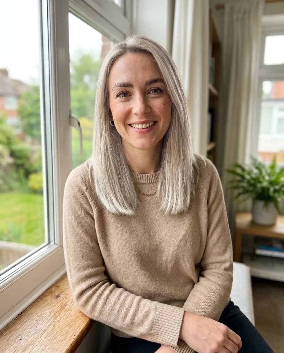 The same woman with her own haircut in platinum blonde and laminated brows