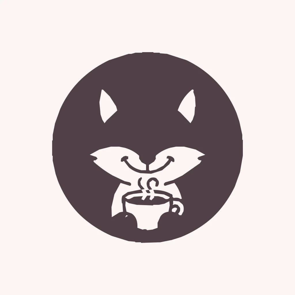 The fox badge traced in black and white: a dark circle with light ears, cheeks and cup, no eyes or nose